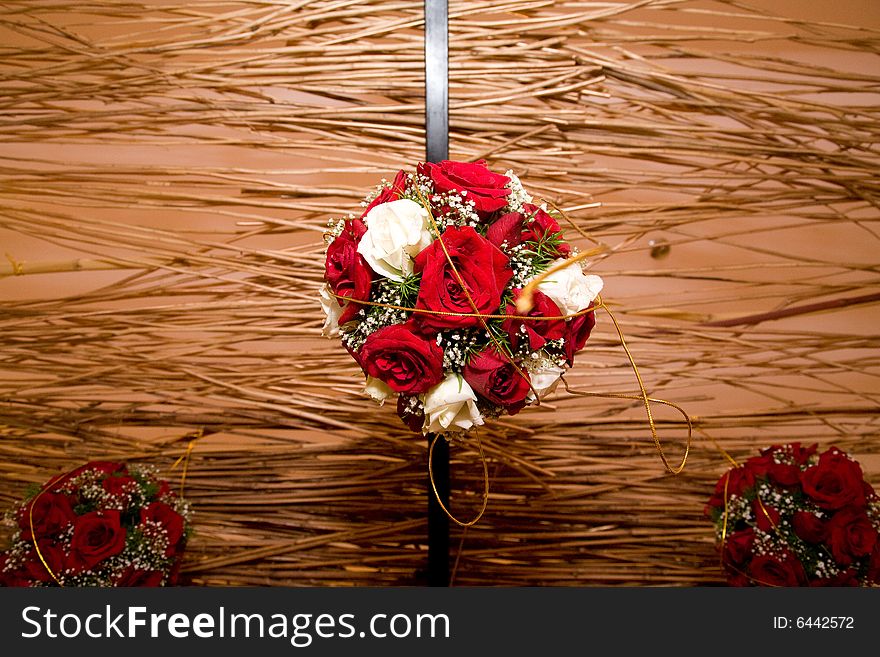 Roses bouquet ball hanging as decoration on wedding celebration