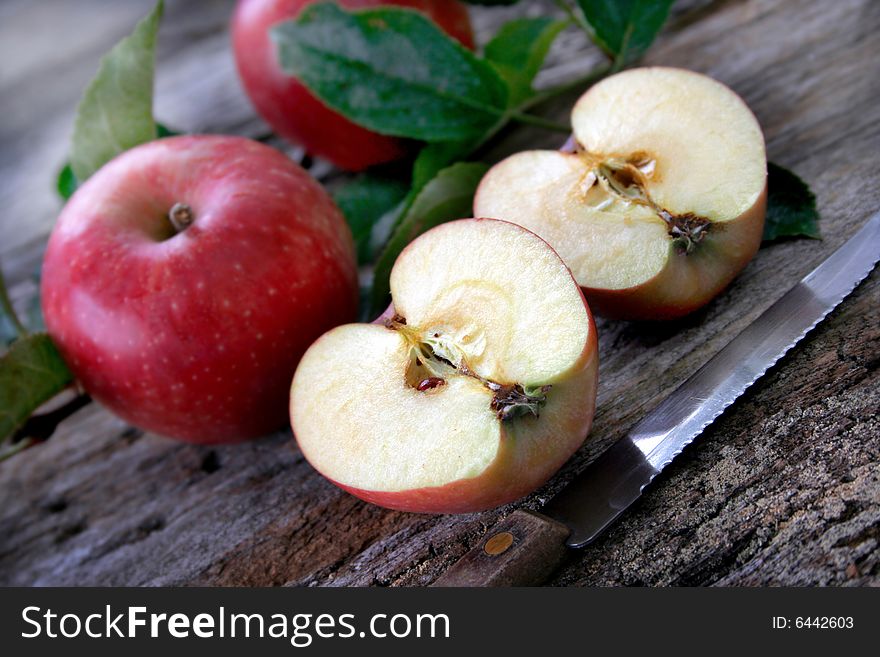 Fresh apples just sliced on a rustic background. Fresh apples just sliced on a rustic background.