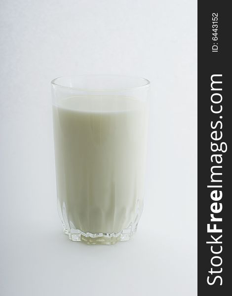 Glass of milk close-up isolated on white background