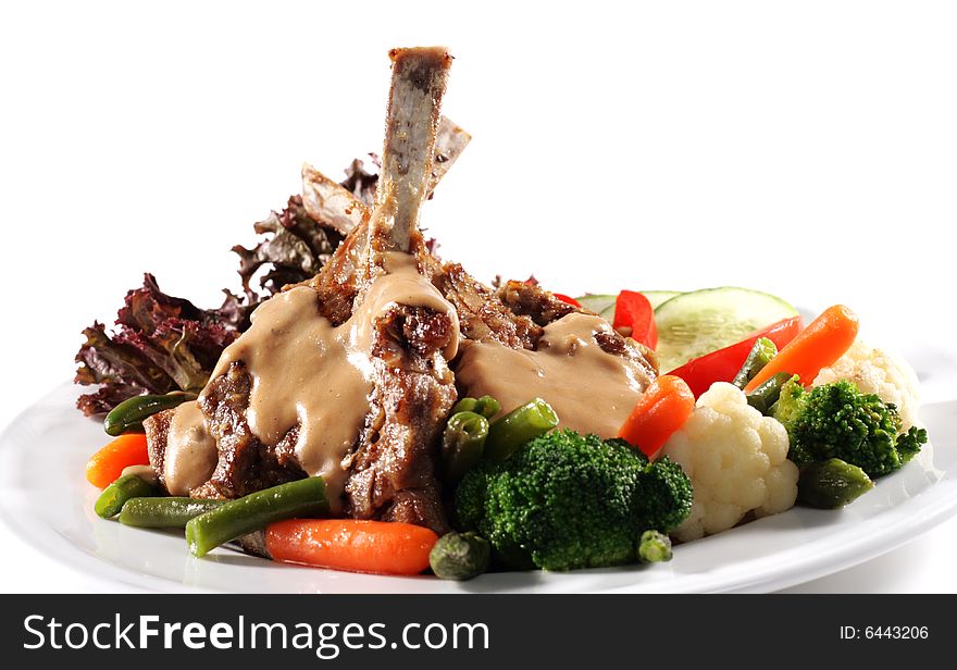 Pork Ribs Plate with Vegetables and Cabbage. Isolated on White Background