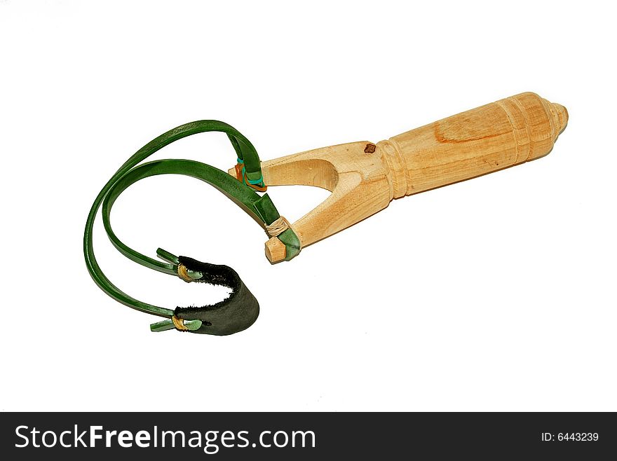 Wooden slingshot with green ribbon isolated over white