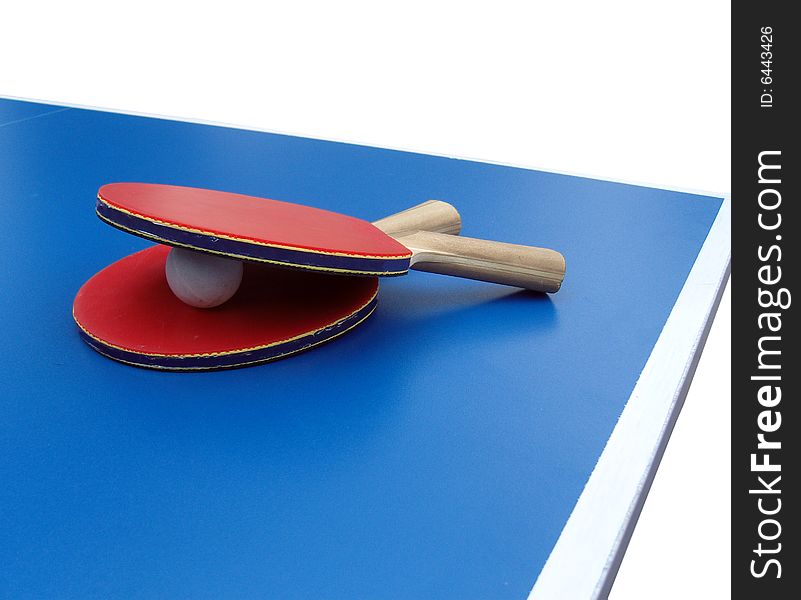 Two table tennis rackets and a ball