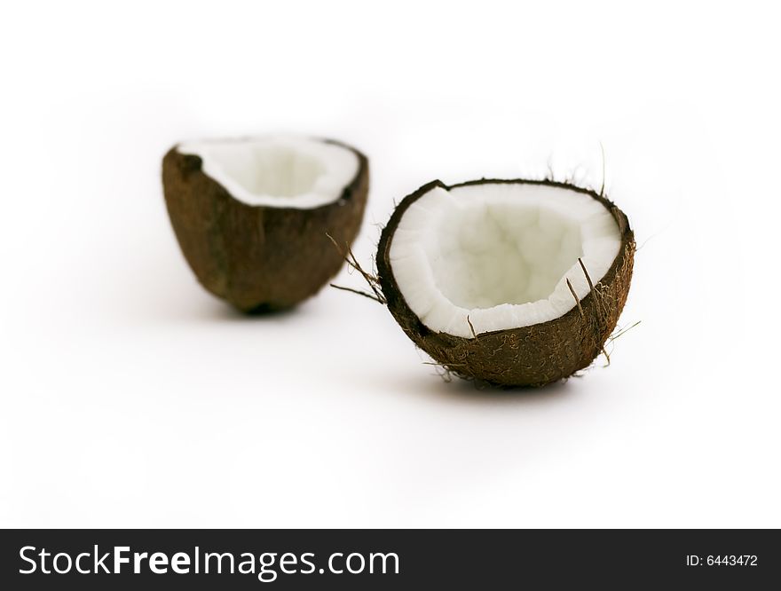 Broken coconut close-up isolated on white. Broken coconut close-up isolated on white