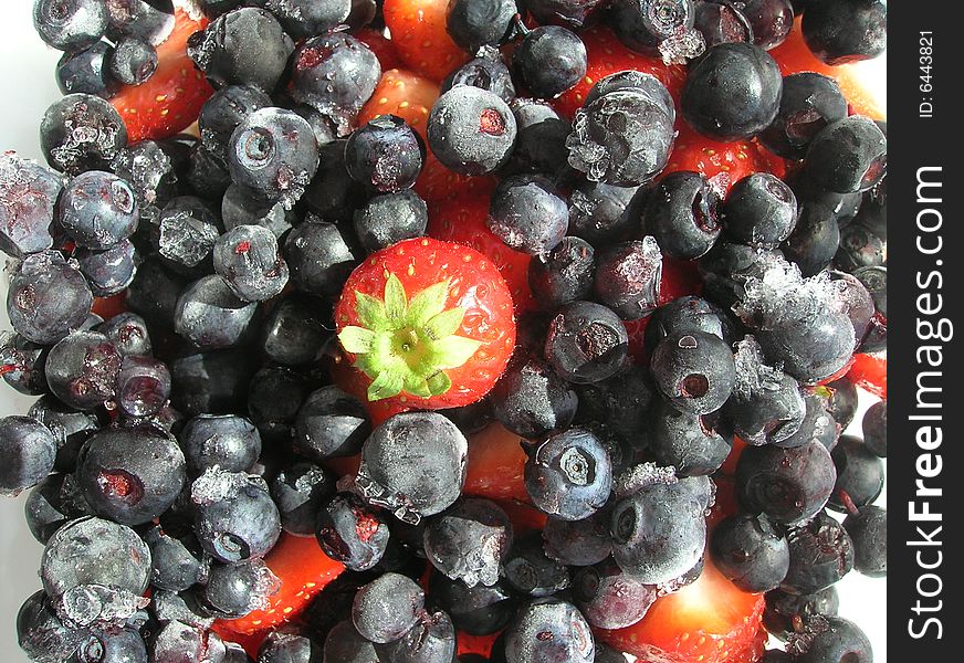 Picture of strawberries and frozen blueberries. Picture of strawberries and frozen blueberries