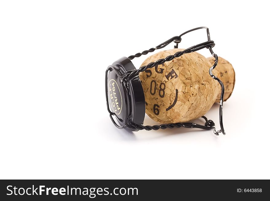 Sparkling wine cork with metal cage isolated on white background. Sparkling wine cork with metal cage isolated on white background