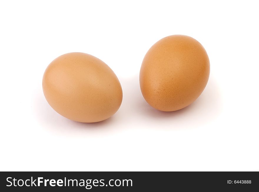 Pair of chicken eggs isolated on white background