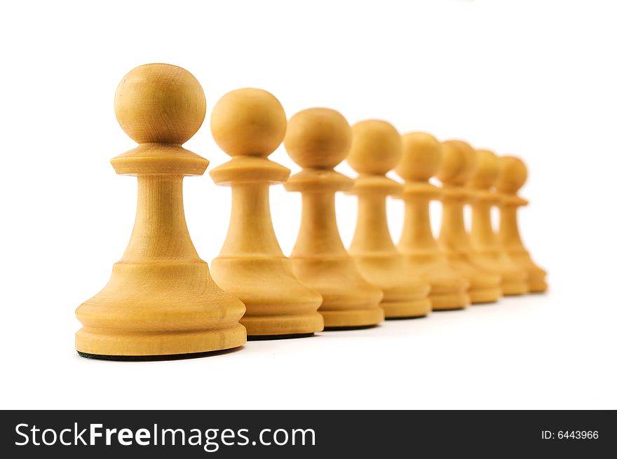 Row of white pawns isolated on white background. Shallow depth of focus. Row of white pawns isolated on white background. Shallow depth of focus
