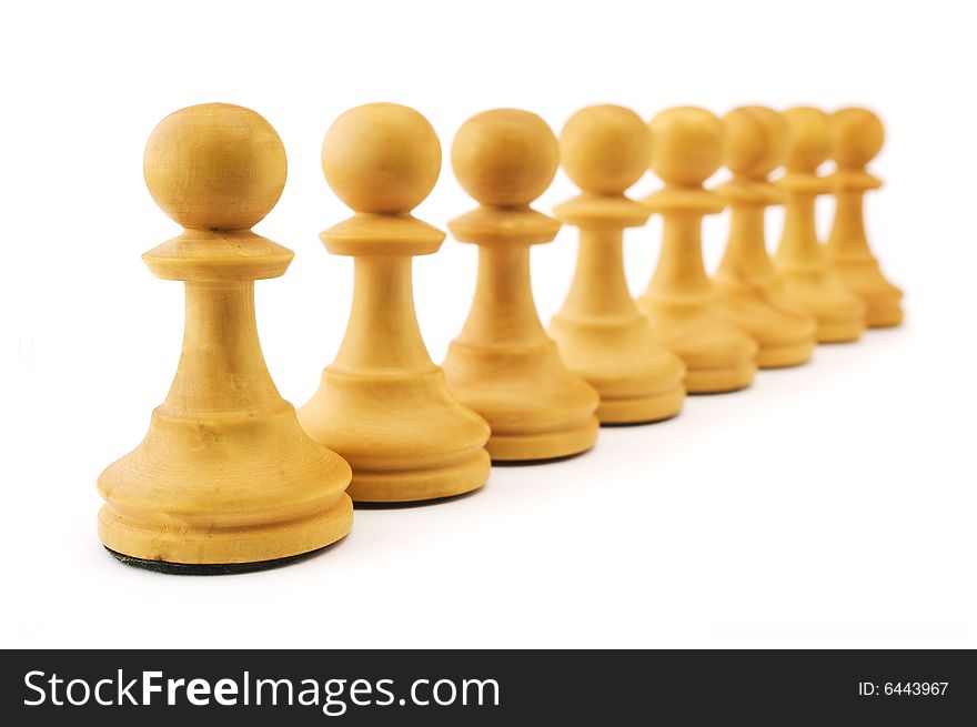 Row of white pawns isolated on white background. Shallow depth of focus. Row of white pawns isolated on white background. Shallow depth of focus