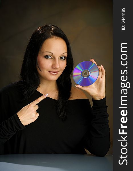 Girl with DVD  disk in the studio
