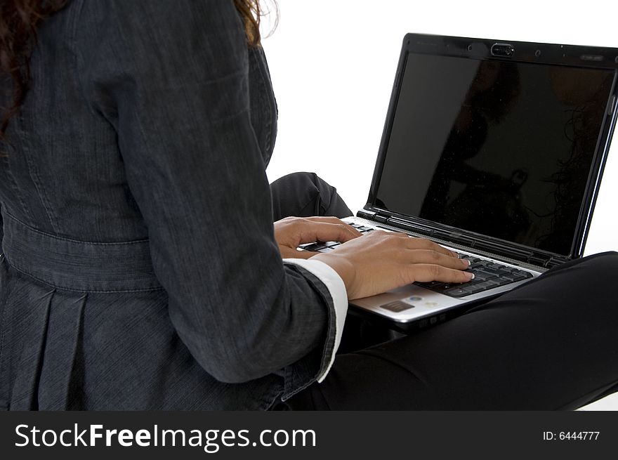 Fingers on keyboard of laptop