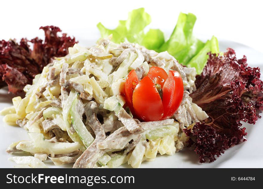 Salad from Beef and Vegetables. Serve with Tomato and Greens. Isolated over White