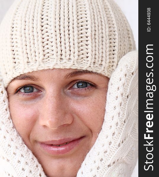 Young woman wearing winter cap and gloves. Autumnal portrait. Young woman wearing winter cap and gloves. Autumnal portrait.