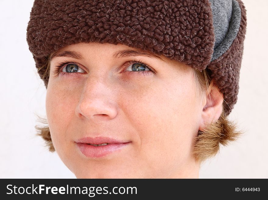 Young woman wearing winter cap. Autumnal portrait. Young woman wearing winter cap. Autumnal portrait.