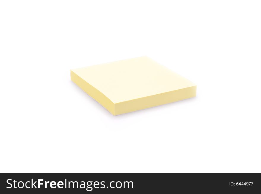 Closeup of a pad of yellow sticky notes. Isolated on white. Closeup of a pad of yellow sticky notes. Isolated on white.