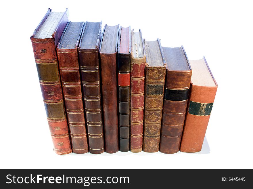 A row of antique leather books isolated on a white background
