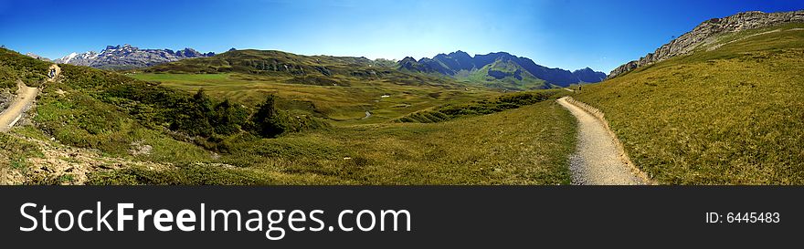 Hiking path in swiss mountains. Panorama view. Hiking path in swiss mountains. Panorama view.