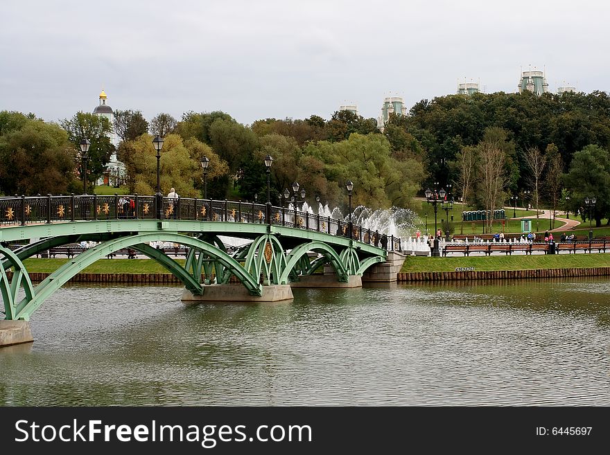 The Foot Bridge Over A Pond