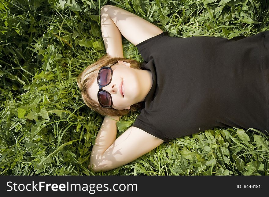 Woman Lying On A Grass