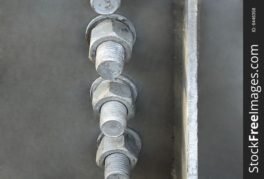 Series of strongly fastened bolts and nuts. Series of strongly fastened bolts and nuts