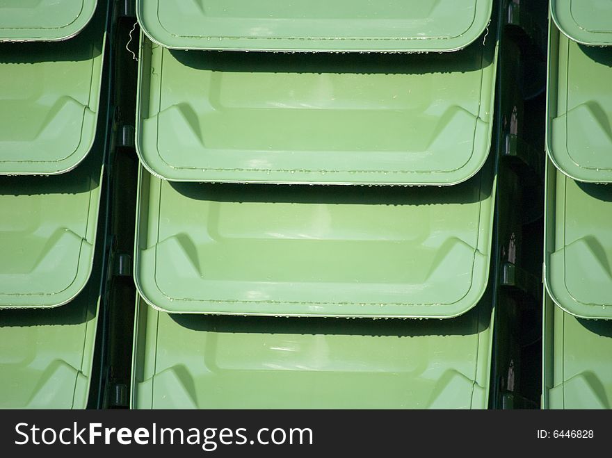 Stack of garbage can lids as a background. Stack of garbage can lids as a background