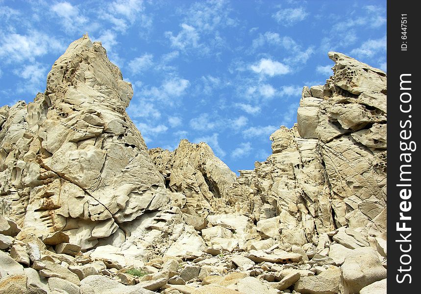 The wall of eroded rocks on Lovers' beach in Cabo San Lucas, Mexico. The wall of eroded rocks on Lovers' beach in Cabo San Lucas, Mexico.