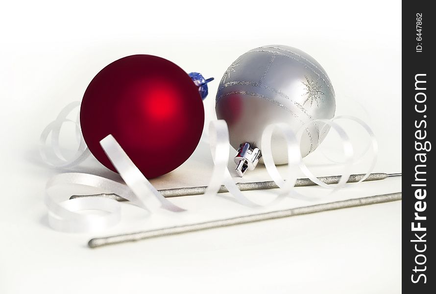 Christmas spheres and sparks on a white background