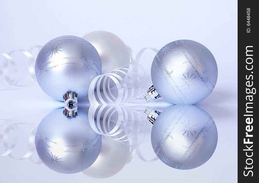 Christmas card. Three white spheres and streamer