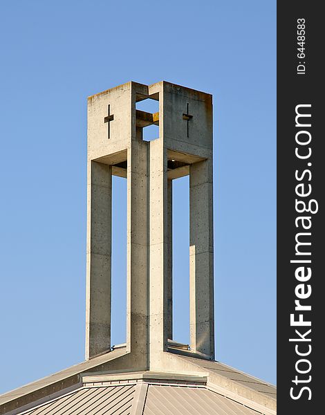 Modern church tower against blue sky - architectural details