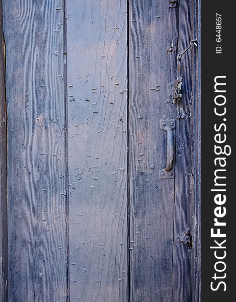 Rustic wooden door with metal handle