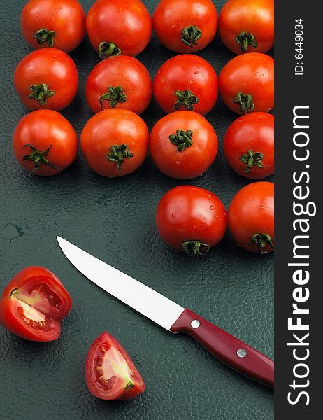 Tomatoes and a kitchen knife. Tomatoes and a kitchen knife