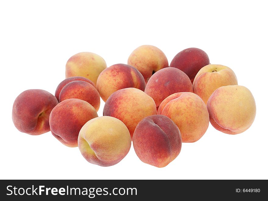 Scattered big and ripe peaches isolated on white background