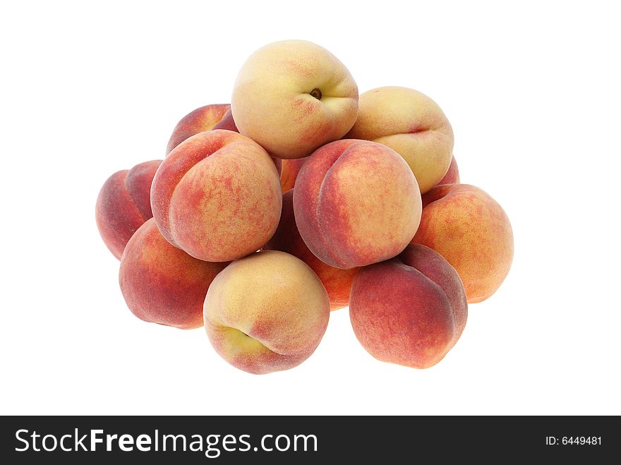 Ripe peaches arranged in heap isolated on white background