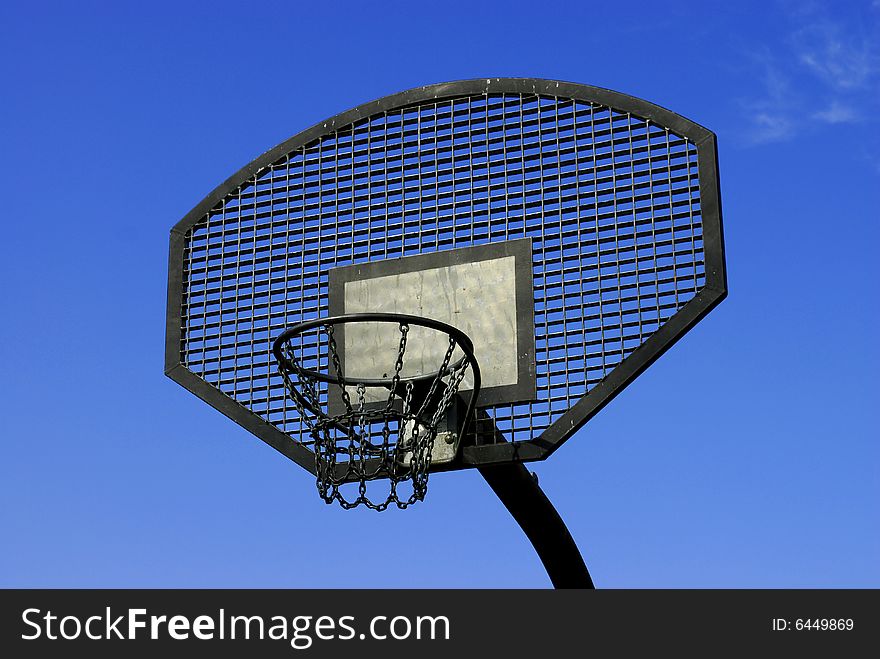 Steel basket for basketball taken upon blue sky