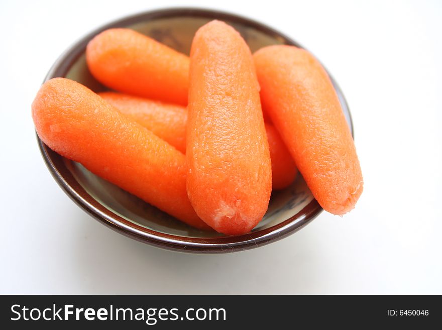 Some baby carrots in a little bowl