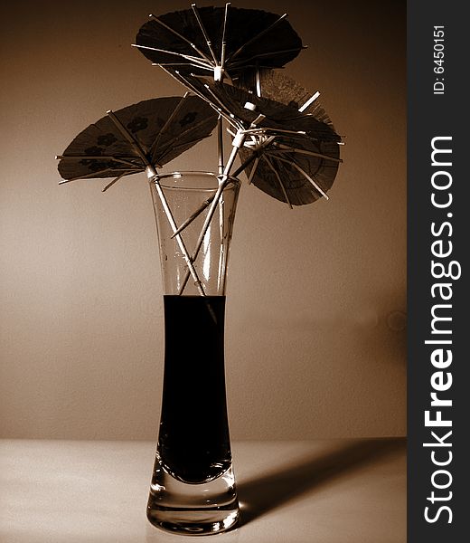 Japanese paper umbrellas in party drink in brown color. Japanese paper umbrellas in party drink in brown color.
