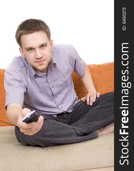 Casual man sitting on sofa with remote control. Casual man sitting on sofa with remote control