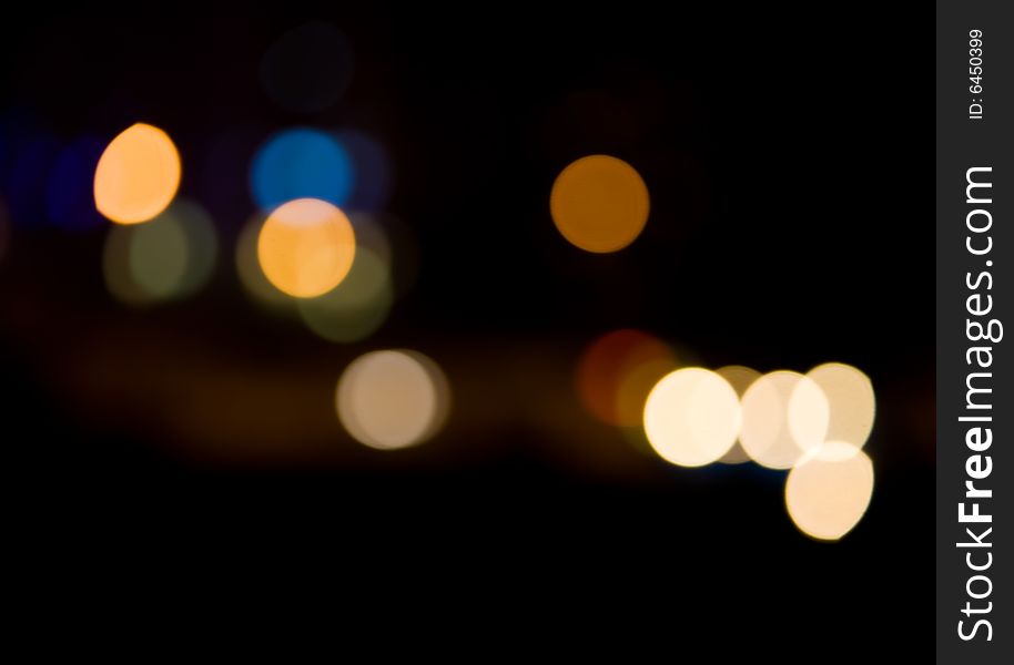 Blurred and defocused lights in night city. Blurred and defocused lights in night city