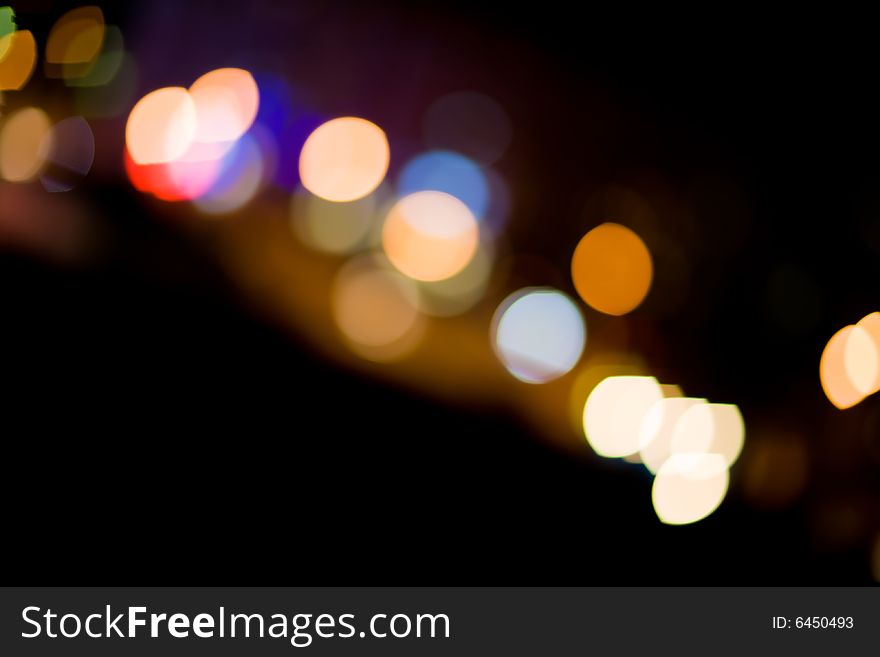 Blurred and defocused lights in night city. Blurred and defocused lights in night city