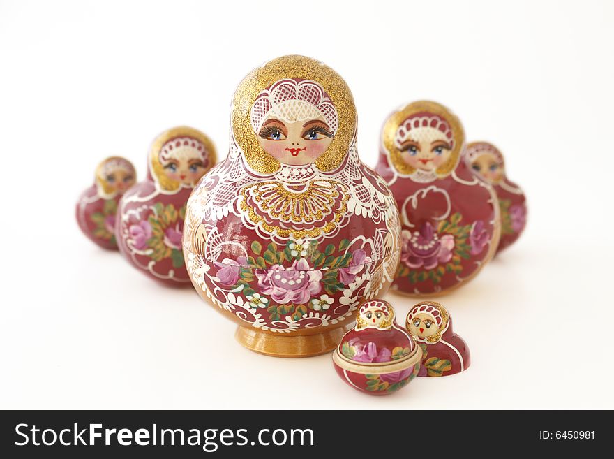 Seven russian dolls in a v- shape on a white background. Seven russian dolls in a v- shape on a white background