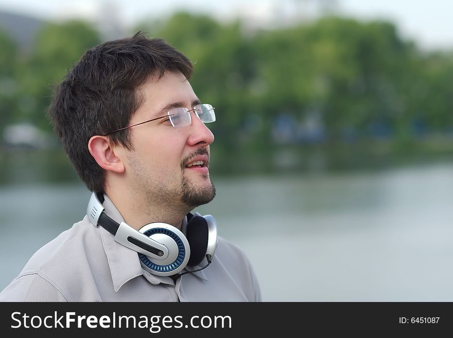 Young Smiling Man With Headphones