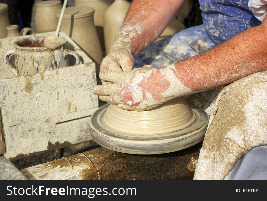 The potter shows the craft for all