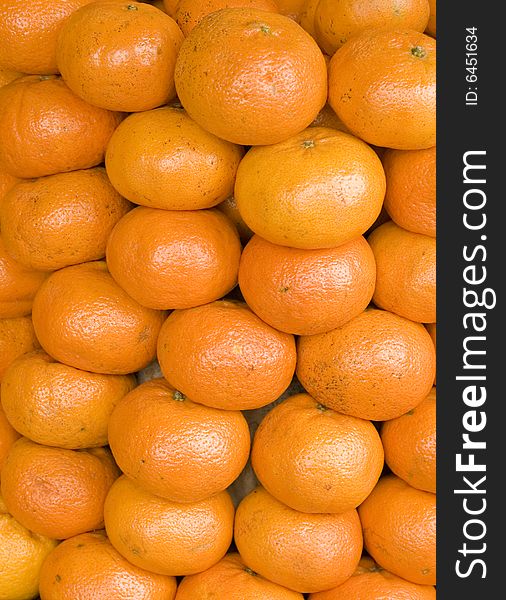 Close up of a lot of tangerines.