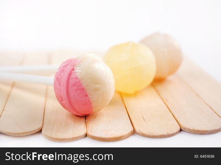 Lollipops on the wooden background