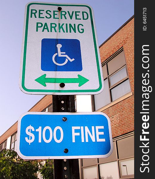 Handicap parking sign with $100 fine sign as well. Handicap parking sign with $100 fine sign as well.
