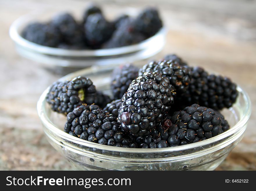 Close up of fresh blackberries in a bowl.