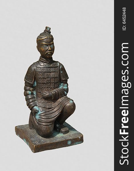 Weathered bronze pawn of old Chinese chess in a shape of ancient warrior isolated on white. Weathered bronze pawn of old Chinese chess in a shape of ancient warrior isolated on white