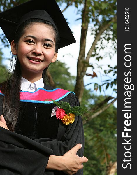 Beautiful Asian university graduates celebrate their success.