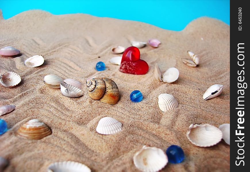Sea shells, sand  and red heart. Sea shells, sand  and red heart