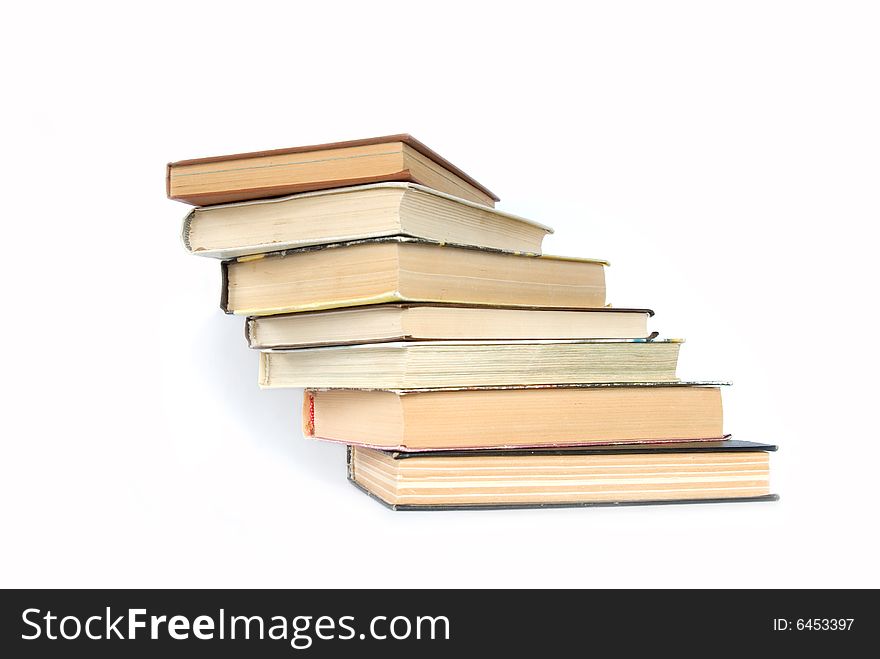 Pile of books on a grey background