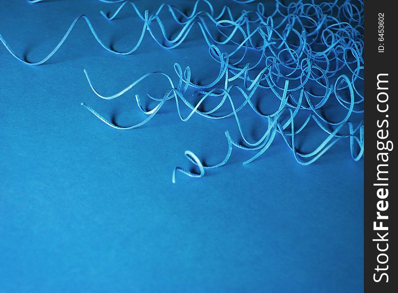 Abstract blue background with paper curls